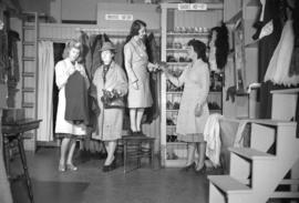 [Women shopping at a clothing and shoe store]