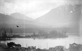 [View of downtown houses, part of Stanley Park, and the North Shore mountains from the roof of Ma...