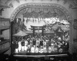[Cast of "The Geisha" on stage showing interior of the Avenue Theatre]