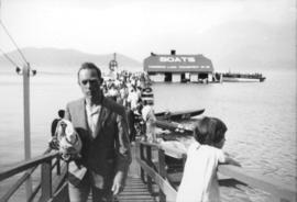 [People exiting ferry wharf, Harrison Lake]