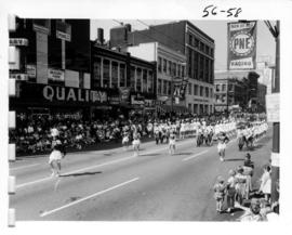 Majorettes and pipe band in 1956 P.N.E. Opening Day Parade