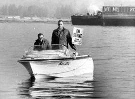 Tow boat operators Hugh Gwynn and Jim Hutton picketing from power boat