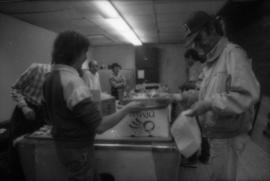 Group packing food in boxes