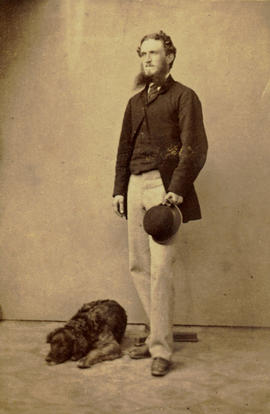 [Full length studio portrait of] Mr. Pooley [with dog]