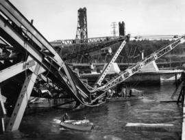 [View of Second Narrows Bridge wreckage and rescue attempts underway in water]