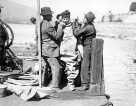 [Waterworks diving crew prepare Mayor L.D. Taylor for First Narrows dive]