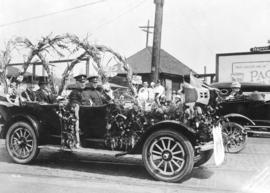 [Mayor] Harry Gale [in car decorated for parade]