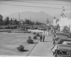 Canada Pacific Exhibition [View of a full parking lot, and the entrance to the exhibition]