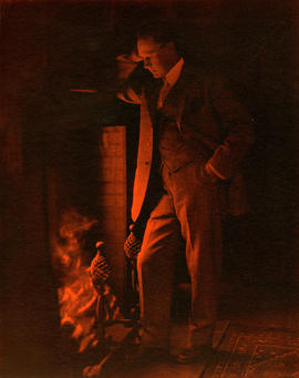 [A study of Alfred T. Layne, actor, at fireside]