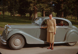 Antoinette Bentley standing in front of blue automobile