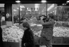 Crew taping outside a shop in Chinatown for the Saltwater City video