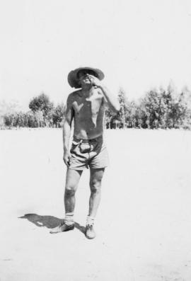 Young man in hat and shorts