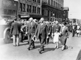 [Yip Sang mourners walking up the west side of the 500 block of Homer Street]