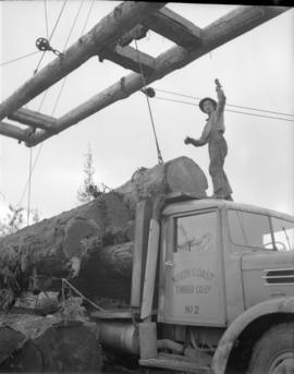 [Loading logs onto a truck for] Pacific Mills [on the] Queen Charlotte Islands