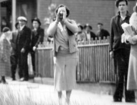 [A woman shouts at police during the Powell Street Riot]