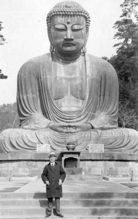 [L.D. Taylor standing in front of a buddha statue in] Kamakura Japan - old capital