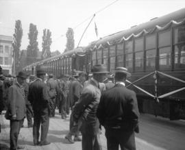 [Men on platform outside interurban railway cars decorated for opening at Saanich Interurban Rail...