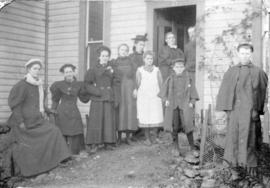 [Group portrait at back door of Fitzgerald McCleery's residence at D.L. 315 (2650 W. 50 Avenue)]
