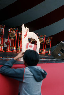 Audience member watching the Kang Sun Young's Dancers performance during the Centennial Commissio...