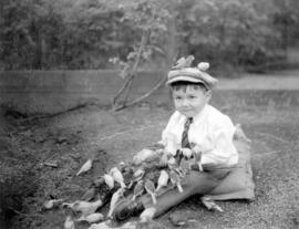 [An unidentified boy at Charles E. Jones' Birds' Paradise]