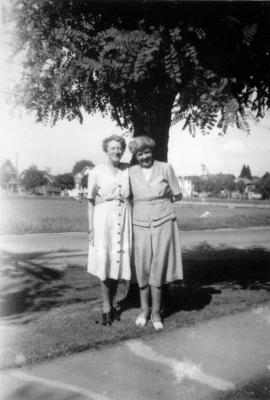 Doris Armstrong (right) and Florrie Wilson in [front of Heather] park by 3500 Willow Street[, Van...