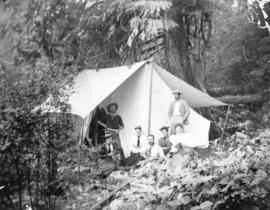 [H.C. Akroyd and others in a tent in a logging camp]