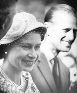 [H.R.H. Queen Elizabeth and H.R.H. The Prince Philip Duke of Edinburgh watch the entertainment at...