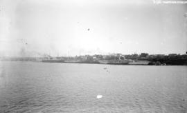[View of Vancouver waterfront, showing docked ships and some buildings]
