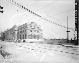 [Men laying streetcar tracks in front of second C.P.R. station]