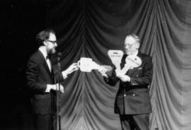 Hugh receives oversized keys to the Arts Club from Bill Millerd