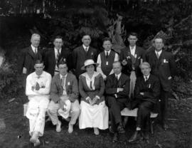 Music dealers picnic, group portrait of male officials with woman in centre