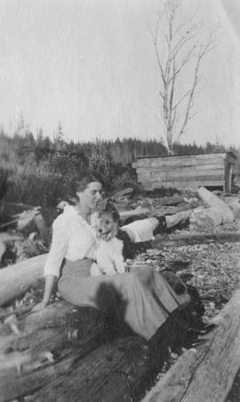 Aldyen Hendry and her long-haired terrier at the beach