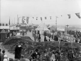 [The Georgia Viaduct closed to traffic during a carnival showing military displays and a refreshm...