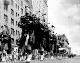 [A Highlander bagpipe and drum band in the Diamond Jubilee Parade]