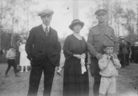 Robert, Grace, and John Girvan with a man in military uniform