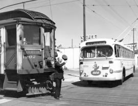 [The first trolley bus and the last Vancouver Lulu Island inter urban tram at the intersection of...