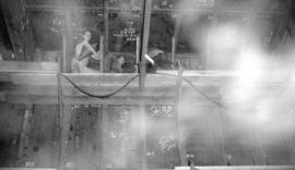 [Men at work on ship at Burrard Drydocks]