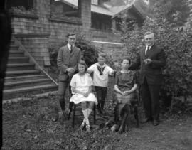 Mr. Pooley and family [in front of house in Dollarton]