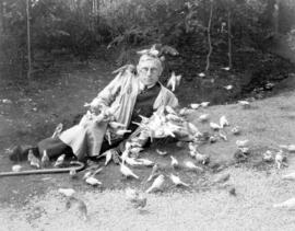 [Charles E. Jones' feeding the birds at Birds' Paradise]