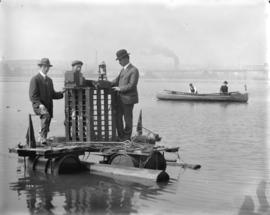 [Three men on float in False Creek conducting an electrolysis survey]