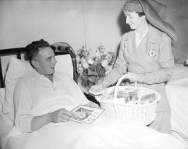 Red Cross nurse [handing out cigarettes at] Shaughnessy Hospital