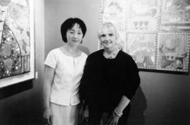 Tien Ching, owner of Omega Custom Framing and Gallery, with artist Roz Marshall, at a showing of ...