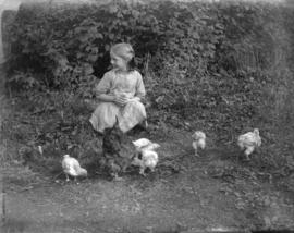 [Jean Davidson feeding chickens]