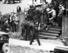 [Police dispersing a crowd during the Powell Street Riot]