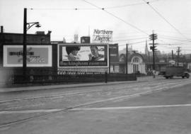 [Neon Products billboards at the north end of the Cambie Bridge]