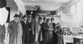 [Vancouver Exhibition - Group of men standing next to coal mining exhibit]
