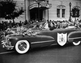 Decorated car carrying dignitaries, including B.C. Premier B. Johnson, in 1949 P.N.E. Opening Day...