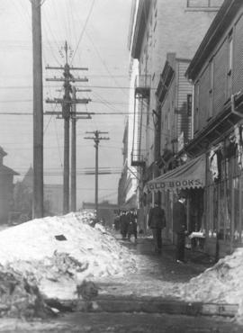 [Snow piled on the sidewalk between Seymour Street and Richards Street]