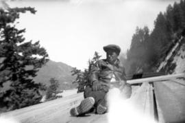 Man sitting on top of freight train