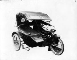 [Alfred T. Layne's motorcycle with hood up]